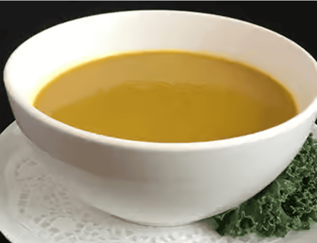 White bowl filled with pumpkin soup