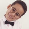 Smiling child with bow tie and glasses