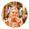 Person eating and smiling in restaurant