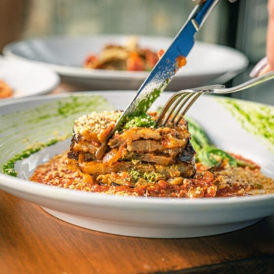 Slicing into cheesy eggplant dish