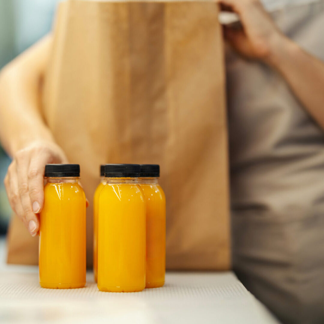 Orange juice bottles on a counter