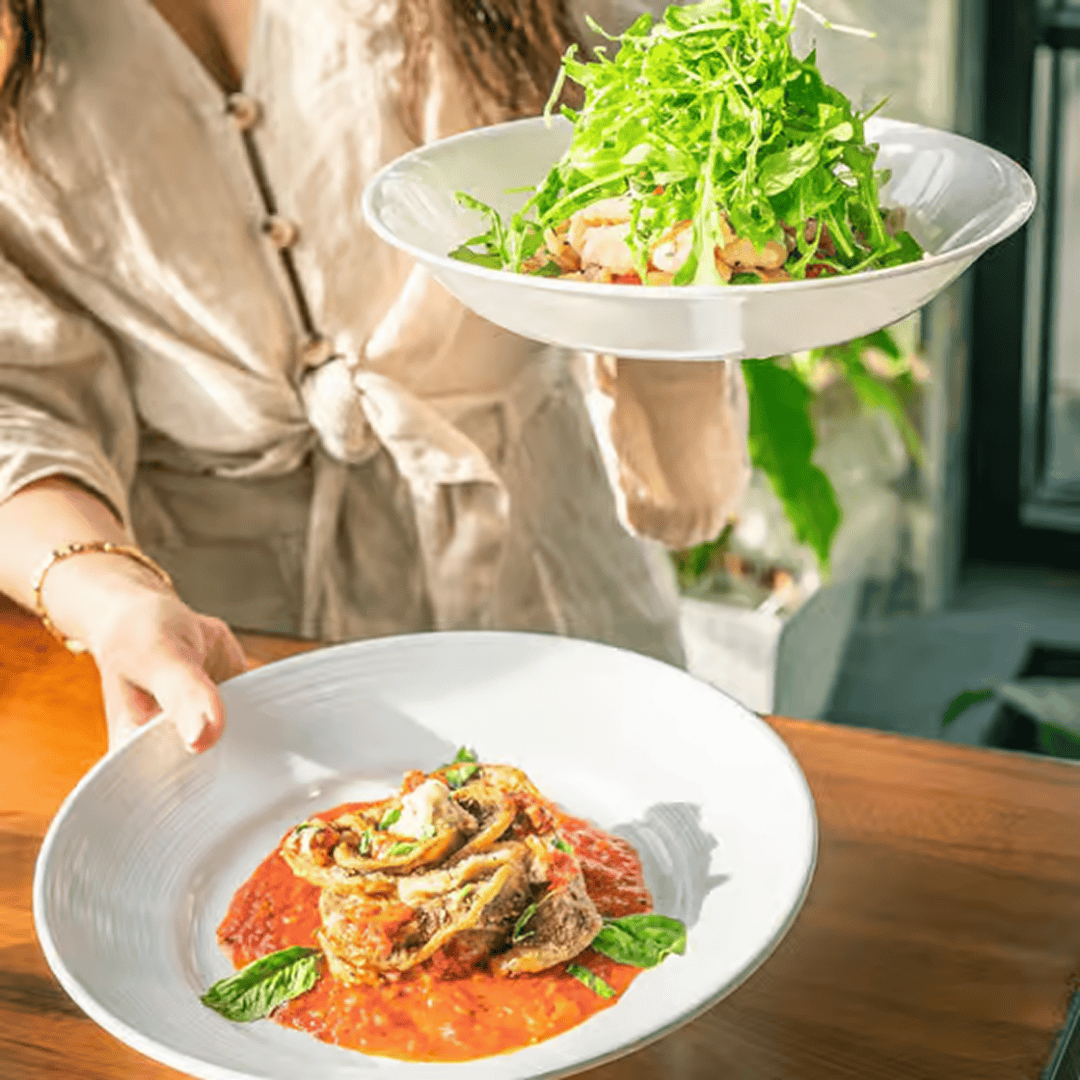 Fresh salad and meat dish on table